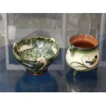 Decorative ornaments, two in all, one is a small cauldron marked 'Warumle', glazed with a blue tit