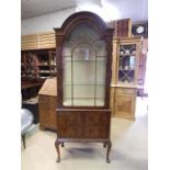 A 20th century Walnut glass display cabinet / vitrine? Standing on cabriole legs (Key in office)