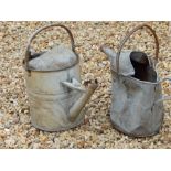 two galvanised watering cans