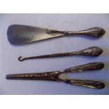 A silver handled Shoe Horn, Maker BP over DC, A Silver handled crochet hook, Maker JD over WD,