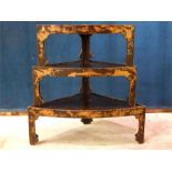 A nest of three black lacquer and painted graduating Oriental / Chinese tables. Decorated with
