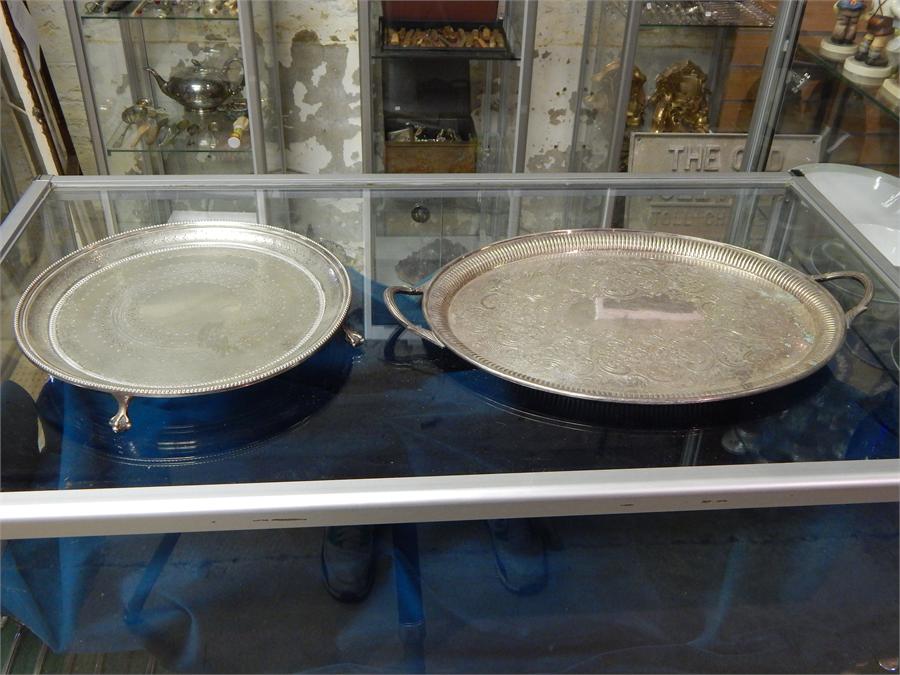 Oval silver plated EPNS twin handled tray along with a round plated tray on claw feet.