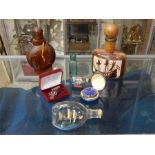 A selection of souvenirs, eleven items in all, including naval bottles, a Military 30 years