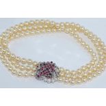 18ct white gold, three strand pearl necklace (pearls approx 5mm in diameter) with an 18ct white