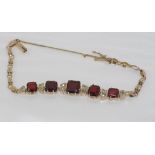 Vintage gilt metal and garnet bracelet with colourless gemstones, weight: approx 10.4 grams