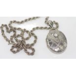 Victorian silver locket on silver twist chain hallmarked Birmingham 1905 (date letter rubbed)