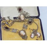 Vintage boxed cameo and red glass set comprising necklace and bracelet with a similar set of cameo
