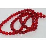 Opera length red glass bead necklace