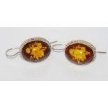 Silver and amber carved earrings