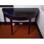 Black painted demilune table 122cm wide, 55cm deep, 71cm high approx