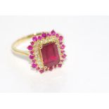 18ct yellow gold and ruby and diamond ring 3.06ct ruby (treated) and 22 diamond .18ct, weight: