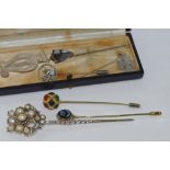 Stone set 14ct gold stick pin weight: 6.7 grams together with various other stick pins in box