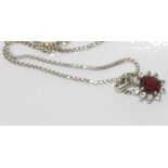 Silver and garnet pendant on silver chain