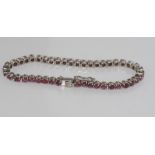 Silver and pink-red spinel bracelet