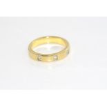 18ct yellow gold and three diamond band weight: approx 4.53 grams, size: K/5