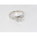 Platinum and 1.04ct diamond ring G SI2 and 6 diamonds, TDW = 0.47cts, weight: approx 7.9grams, size: