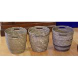 Three woven cane planter baskets 38cm high