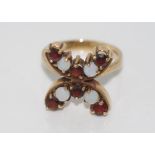 9ct gold, garnet and opal ring weight: approx 6.5 grams, size: T/9-10