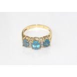 14ct yellow gold & blue topaz trilogy ring weight: approx 3.5grams, size: N/6-7