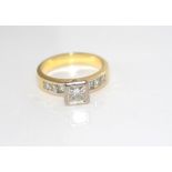 18ct yellow gold and diamond ring diamonds 1=0.52ct H/SI1, with 3 channel set princess cut