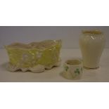 Two Belleek porcelain vases together with a Belleek shamrock napkin ring, 8.5cm approx (tallest)