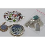 Three large silver pendants together with four silver pendants