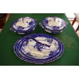 Quantity of Meakin antique flow blue china pieces comprising a graduated set of 3 platters, 2 lidded