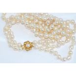 Matinee length double strand pearl necklace with baroque pearls and a 9ct gold and pearl clasp