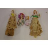 Four early porcelain half dolls