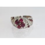 18ct white gold ruby and diamond ring in original Bruce and Walsh box, weight: approx 8.8 grams,