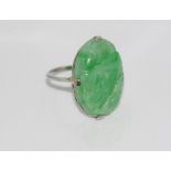 18ct white gold and carved green stone ring (tests suggest jade), weight: approx 6.37 grams, size: