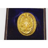 Boxed Victorian 15ct gold mourning brooch with ornate filigree work. Front section opens to reveal