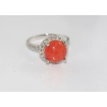 14ct white gold, red coral and diamond ring weight: 4.45 grams, size: approx N-O/7