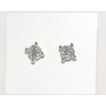 18ct white gold & diamond earrings Two diamonds= 0.33ct, H / Si 2, weight: approx 1.2 grams