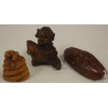 Three oriental carved timber netsukes H4.5cm approx (tallest)