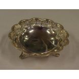 Sterling silver tri footed pierced bon bon dish hallmarked Birmingham 1935, 12 cm diameter, 70 grams