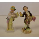 Two small antique German figures A gentleman with a hat, together with a farmer & wheat.