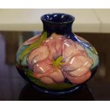 Moorcroft magnolia squat vase green signature and factory marks to base, 11cm high approx