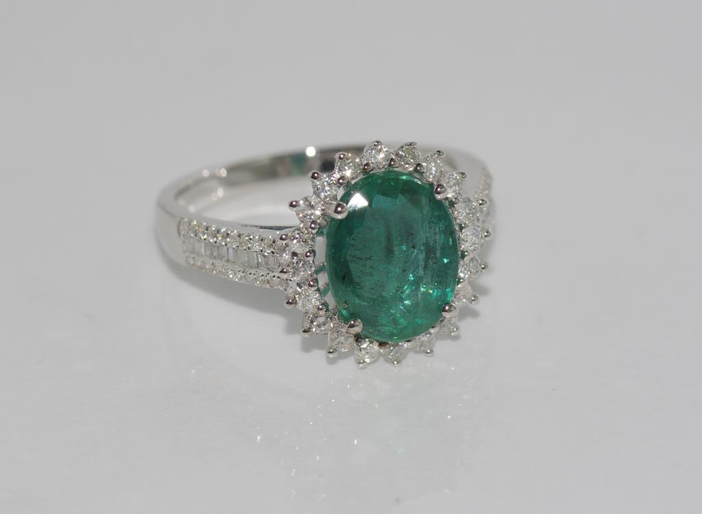 18ct white gold, emerald (1.29ct) and diamond ring total diamonds = 0.69ct, weight: approx 4.4