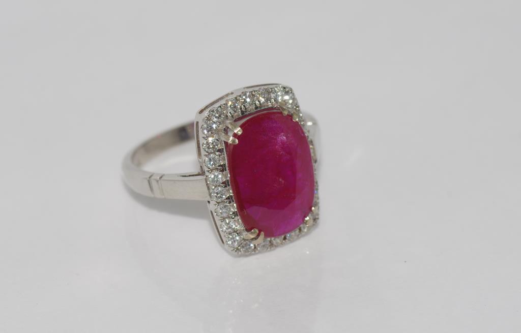 18ct white gold, 3.11ct natural ruby &diamond ring includes 26 round brilliant cut V set diamonds