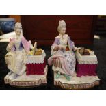 Good pair of Meissen figures ladies at the dressing table,both with blue crossed swords to base.