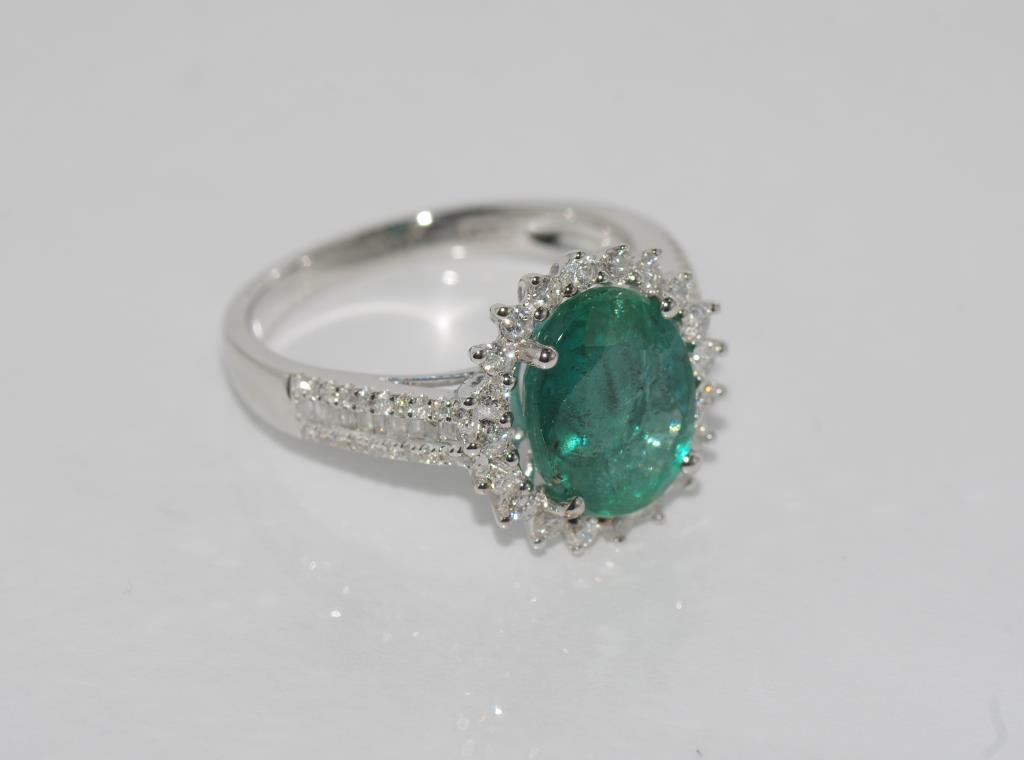 18ct white gold, emerald (1.29ct) and diamond ring total diamonds = 0.69ct, weight: approx 4.4 - Image 2 of 3