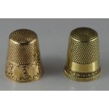 Two gold thimbles one 9ct, the other 14ct. Total weight 7gms