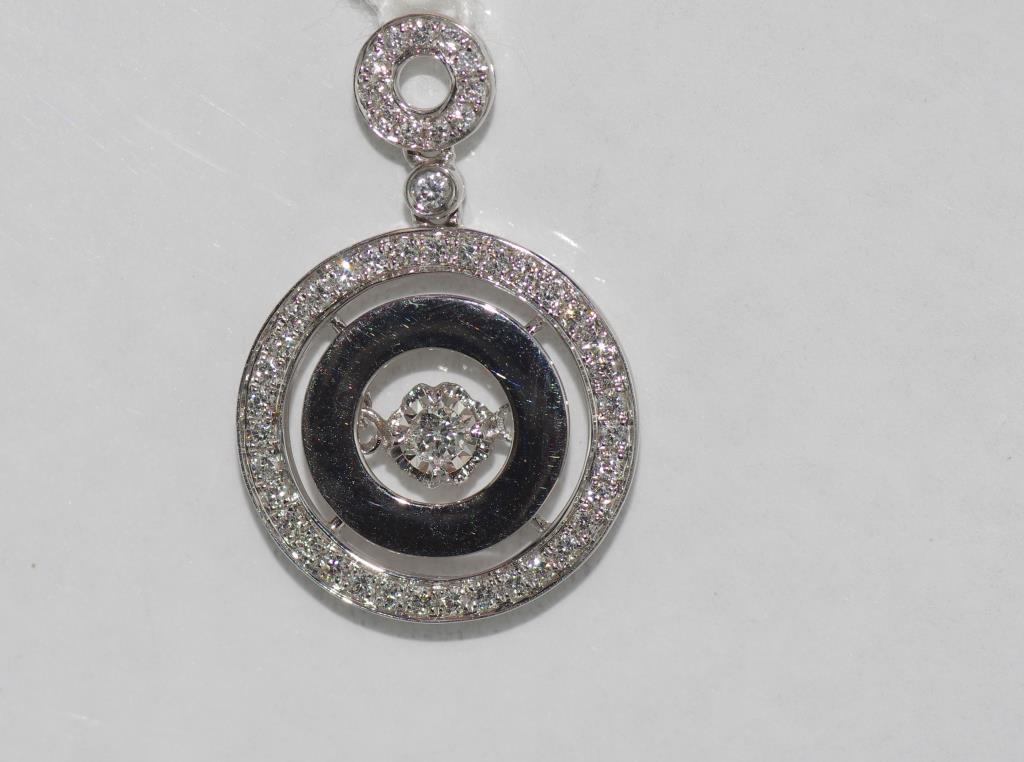 18ct white gold and "dancing" diamond pendant 48 diamonds TDW= 0.56ct, weight: approx 3.47 grams,