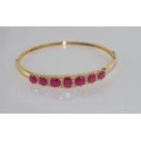 18ct yellow gold ruby and diamond bangle 22 diamond = 41 points, rubies = 6.9cts, weight: approx