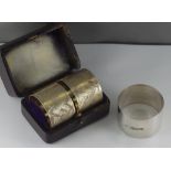 Pair of boxed sterling silver napkin rings engraved with Stork & foliage design, no silver marks,