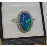 18ct white gold, solid black opal and diamond ring includes gemstone certificate: Lightning Ridge