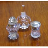 Three various scent bottles 2 with sterling silver mounts, one being Orrefors 10cm high approx.