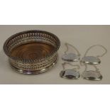 Victorian silver plated coaster together with four silver plated decanter labels comprising