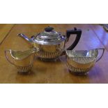 Late Victorian Bachelor stg silver tea service comprising of a teapot, sugar bowl and creamer,